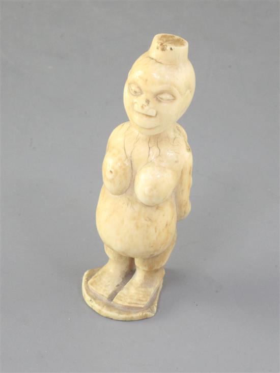 A 19th century African ivory group of a mother and child, height 3.25in.